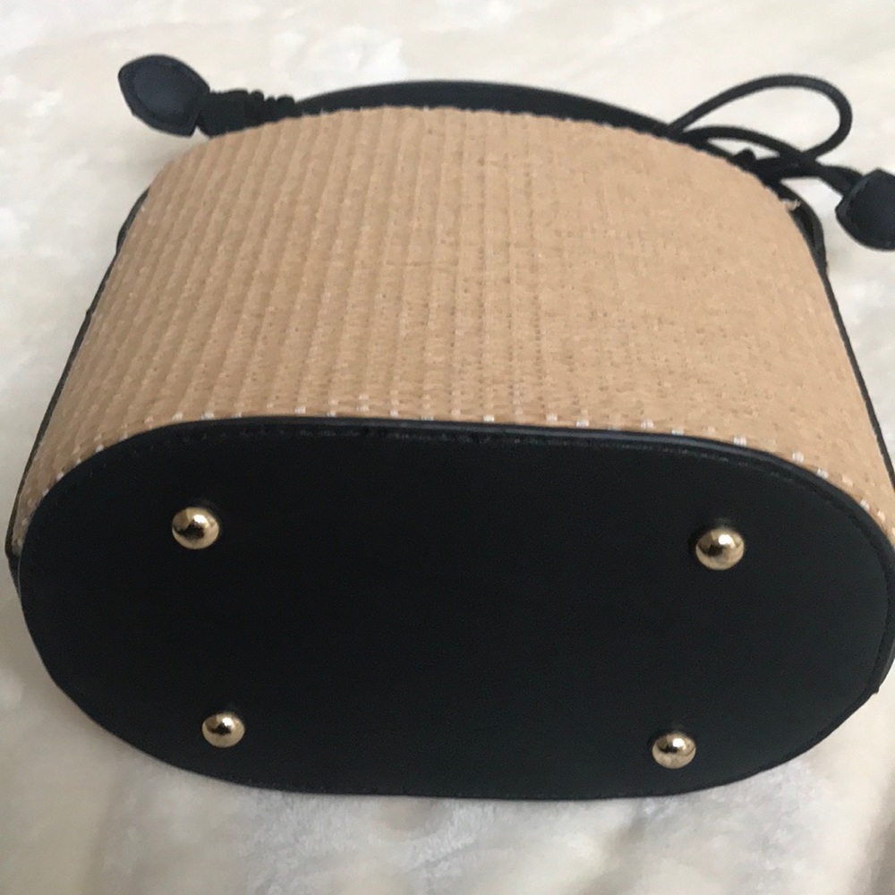 Brand new summer hand bag tan straw and black handle and trim.